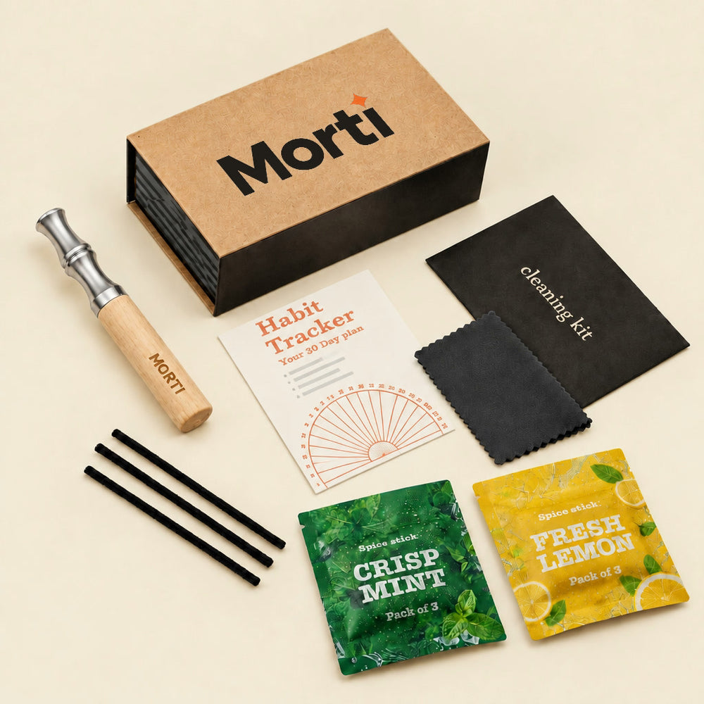 Everything in a Morti kit: gift box, wooden Morti pen, Habit Tracker card, cleaning kit with cloth and 3 cleaning sticks, and flavor pouches