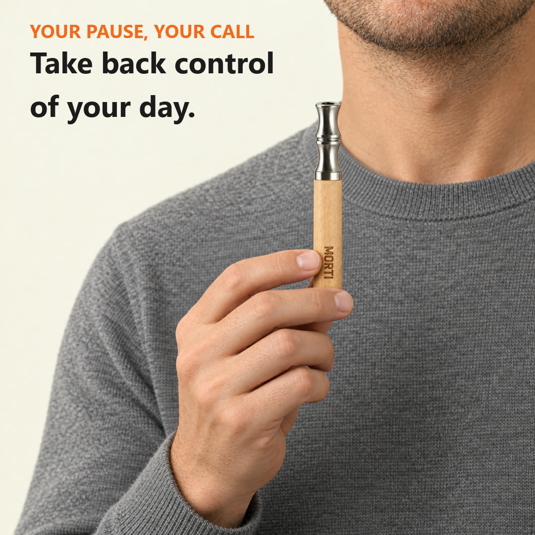 Take back control of your day: a man holding his Natural Wood Morti pen