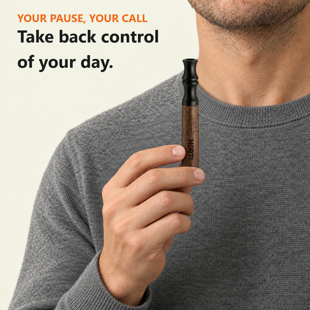 Take back control of your day: a man holding his Walnut Morti pen